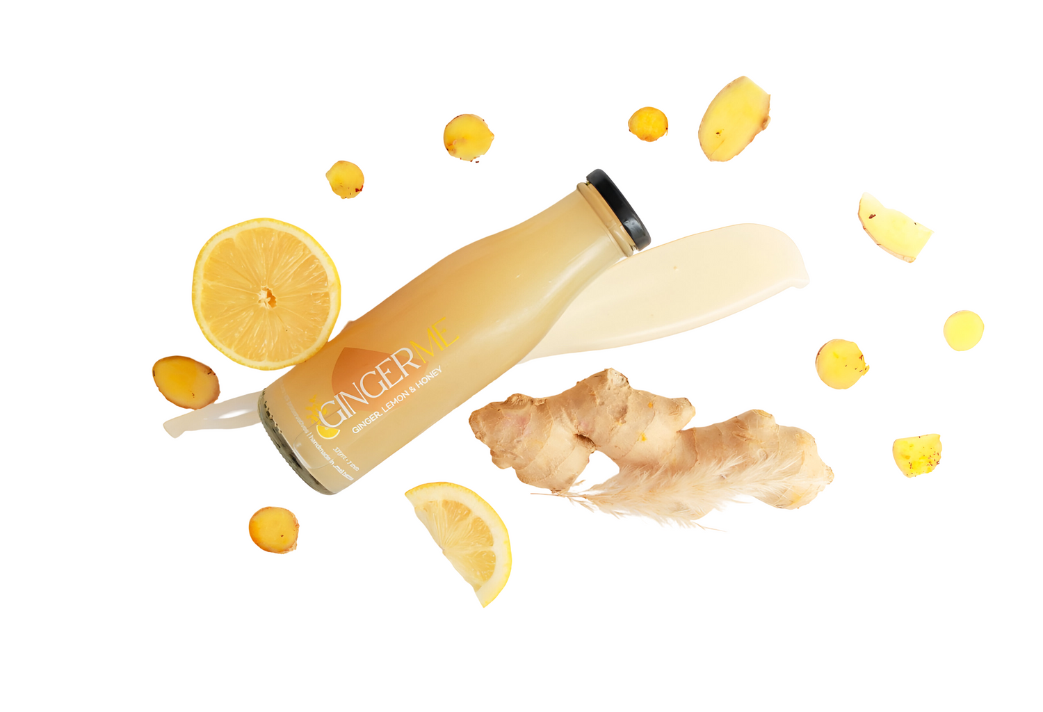 Ginger Shot bottle with lemon slices, ginger and a honey streak on a white background